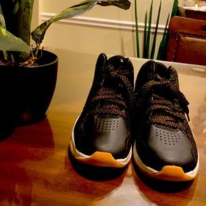 AND1, men’s size 9, black and gold